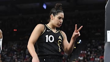 Las Vegas Aces guard Kelsey Plum motions to the camera after being fouled.