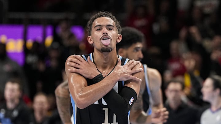 Atlanta Hawks guard Trae Young (11) reacts after making a three point basket against the Indiana Pacers