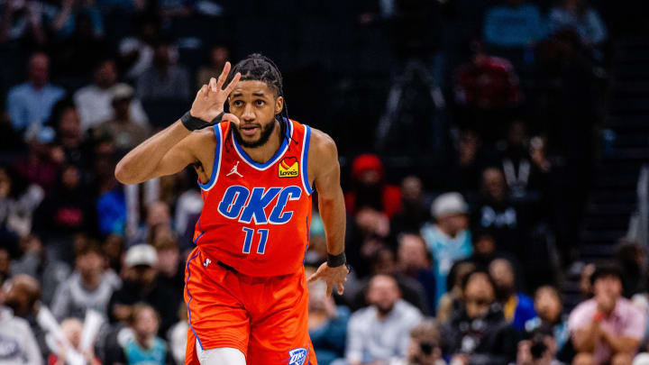 Apr 7, 2024; Charlotte, North Carolina, USA; Oklahoma City Thunder guard Isaiah Joe (11) celebrates a three point basket against the Charlotte Hornets during the fourth quarter at Spectrum Center. Mandatory Credit: Scott Kinser-USA TODAY Sports