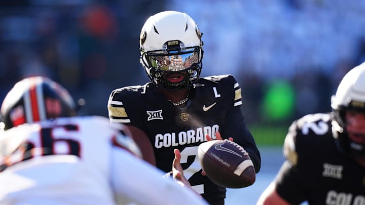 Nov 29, 2024; Boulder, Colorado, USA; Colorado Buffaloes quarterback Shedeur Sanders (2) takes a hike in the first quarter against the Oklahoma State Cowboys at Folsom Field. Mandatory Credit: Ron Chenoy-Imagn Images Nov 29, 2024; Boulder, Colorado, USA; Colorado Buffaloes quarterback Shedeur Sanders (2) takes a hike in the first quarter against the Oklahoma State Cowboys at Folsom Field. Mandatory Credit: Ron Chenoy-Imagn Images