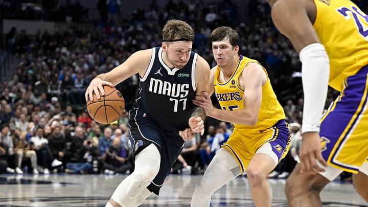 Dec 12, 2023; Dallas, Texas, USA; Dallas Mavericks guard Luka Doncic (77) and Los Angeles Lakers guard Austin Reaves (15) in action during the game between the Dallas Mavericks and the Los Angeles Lakers at the American Airlines Center. Mandatory Credit: Jerome Miron-Imagn Images