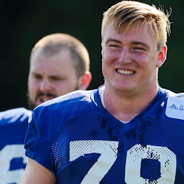 Indianapolis Colts offensive tackle Bernhard Raimann (79) smiles while walking to warm up Saturday, July 27, 2024, during the Indianapolis Colts’ training camp at Grand Park Sports Complex in Westfield.