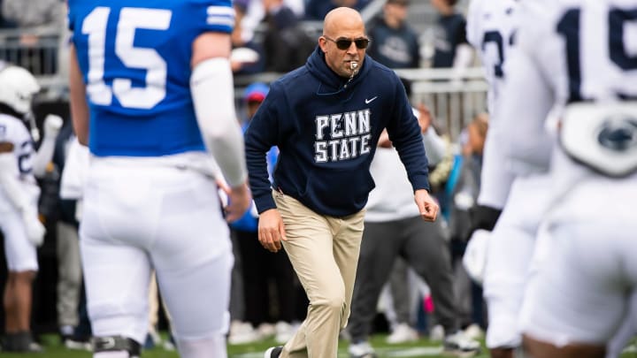 Penn State coach James Franklin jogs through warmups before the Blue-White game at Beaver Stadium. 