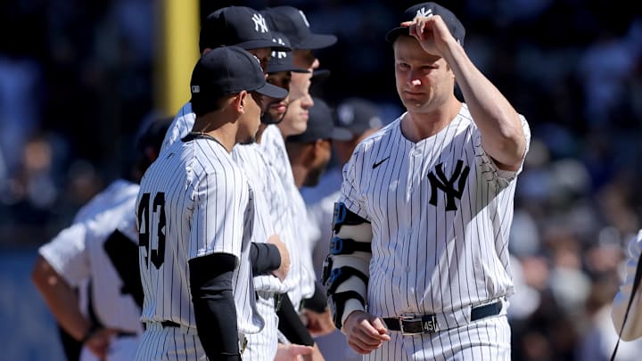 Mar 27, 2025; Bronx, New York, USA; New York Yankees injured starting pitcher Gerrit Cole (45) tips his cap towards the Milwaukee Brewers base line during introductions before an opening day game at Yankee Stadium Mar 27, 2025; Bronx, New York, USA; New York Yankees injured starting pitcher Gerrit Cole (45) tips his cap towards the Milwaukee Brewers base line during introductions before an opening day game at Yankee Stadium