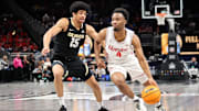 Mar 13, 2025; Kansas City, MO, USA; Houston Cougars guard L.J. Cryer (4) drives to the basket around Colorado Buffaloes guard Felix Kossaras (15) during the first half at T-Mobile Center. Mandatory Credit: William Purnell-Imagn Images