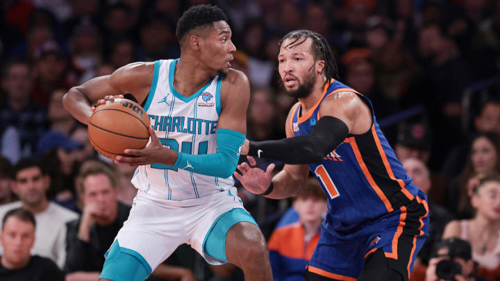 Nov 28, 2023; New York, New York, USA; Charlotte Hornets forward Brandon Miller (24) shields the ball from New York Knicks guard Jalen Brunson (11) during the first half at Madison Square Garden. Mandatory Credit: Vincent Carchietta-USA TODAY Sports