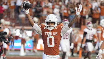 Texas Longhorns wide receiver DeAndre Moore Jr. reacts after making a reception for a touchdown during the second half against the Arkansas Razorbacks at Darrell K Royal-Texas Memorial Stadium.