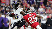 Oct 21, 2024; Tampa, Florida, USA; Baltimore Ravens wide receiver Nelson Agholor (15) runs with the ball as Tampa Bay Buccaneers safety Christian Izien (29) defends during the first half at Raymond James Stadium. Mandatory Credit: Kim Klement Neitzel-Imagn Images