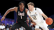 West Virginia Mountaineers guard Tucker DeVries (12) drives to the basket as Gonzaga Bulldogs guard Michael Ajayi (1) defends during the first half at the Atlantis Resort.