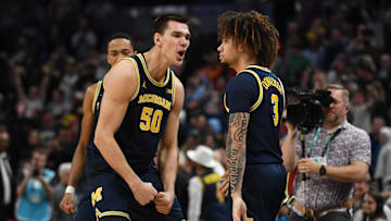 Mar 15, 2025; Indianapolis, IN, USA; Michigan Wolverines center Vladislav Goldin (50) celebrates with Michigan Wolverines guard Tre Donaldson (3) after Donaldson made a game-winning layup with .4 seconds left during the second half against the Maryland Terrapins at Gainbridge Fieldhouse. Mandatory Credit: Robert Goddin-Imagn Images