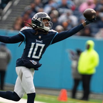 Tennessee Titans wide receiver DeAndre Hopkins (10) hauls in a one-handed grab against Jacksonville Jaguars cornerback Darious Williams (31) in the first quarter of their game at Nissan Stadium in Nashville, Tenn., Sunday, Jan. 7, 2024.