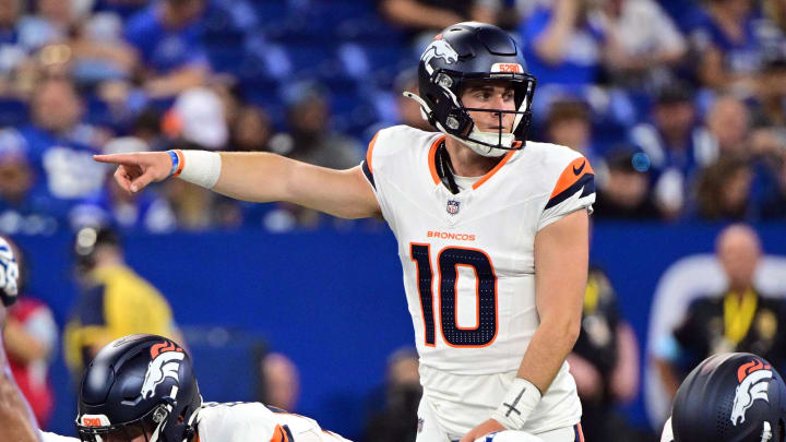 Aug 11, 2024; Indianapolis, Indiana, USA; Denver Broncos quarterback Bo Nix (10) points during the second quarter against the Indianapolis Colts at Lucas Oil Stadium. 