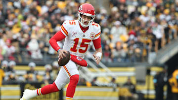 Dec 25, 2024; Pittsburgh, Pennsylvania, USA;  Kansas City Chiefs quarterback Patrick Mahomes (15) runs with the ball against the Pittsburgh Steelers during the first quarter at Acrisure Stadium. Mandatory Credit: Charles LeClaire-Imagn Images