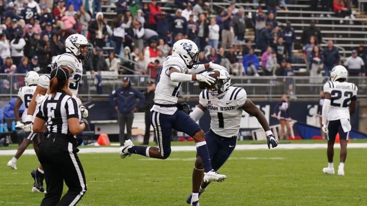 Sep 30, 2023; East Hartford, Connecticut, USA; Utah State Aggies cornerback Al Ashford III (13) reacts after retrieving the blocked extra point by safety Ike Larsen (6) to win the game against the UConn Huskies in the fourth quarter at Rentschler Field at Pratt & Whitney Stadium. Mandatory Credit: David Butler II-USA TODAY Sports