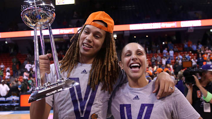 Sep 12, 2014; Chicago, IL, USA; Phoenix Mercury center Brittney Griner (left) and guard Diana Taurasi (right) celebrate with the WNBA championship trophy after defeating the Chicago Sky 87-82 in game three of the 2014 WNBA Finals at UIC Pavilion. Mandatory Credit: Jerry Lai-Imagn Images
