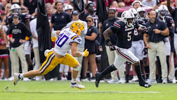 Sep 14, 2024; Columbia, South Carolina, USA; LSU Tigers linebacker Whit Weeks (40) chases South Carolina Gamecocks running back Raheim Sanders (5) during the fourth quarter at Williams-Brice Stadium. Mandatory Credit: Scott Kinser-Imagn Images