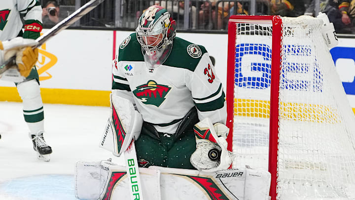 Apr 29, 2025; Las Vegas, Nevada, USA; Minnesota Wild goaltender Filip Gustavsson (32) makes a save against the Vegas Golden Knights during the second period of game five of the first round of the 2025 Stanley Cup Playoffs at T-Mobile Arena. Mandatory Credit: Stephen R. Sylvanie-Imagn Images