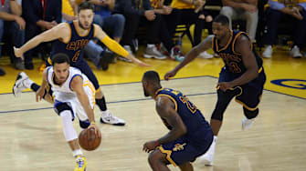 June 4, 2015; Oakland, CA, USA; Golden State Warriors guard Stephen Curry (30) moves the ball against the defense of Cleveland Cavaliers guard Matthew Dellavedova (8), forward LeBron James (23) and center Tristan Thompson (13) during the first half in game one of the NBA Finals. at Oracle Arena. Mandatory Credit: Kelley L Cox-Imagn Images