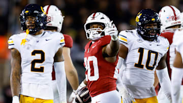 Nov 22, 2025; Stanford, California, USA; Stanford Cardinal running back Micah Ford (20) gestures to the crowd after a first down during the fourth quarter against the California Golden Bears at Stanford Stadium. Mandatory Credit: Sergio Estrada-Imagn Images