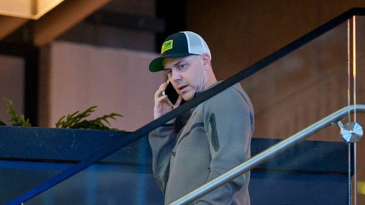 Oregon offensive coordinator Will Stein speaks on the phone as Indiana speaks during a media day as the Oregon Ducks arrive on Jan. 7, 2025, in Atlanta, Georgia ahead of the Peach Bowl at Mercedes-Benz Stadium.