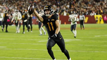 Oct 13, 2025; Landover, Maryland, USA; Washington Commanders wide receiver Luke McCaffrey (11) scores a touchdown against the Chicago Bears during the third quarter at Northwest Stadium. Mandatory Credit: Geoff Burke-Imagn Images