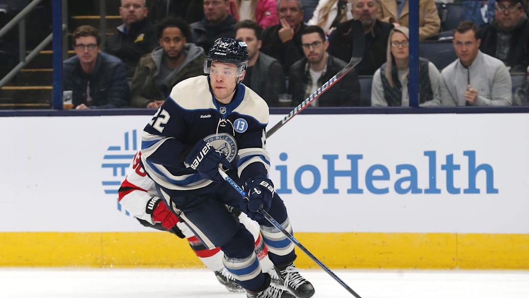 Dec 19, 2024; Columbus, Ohio, USA; Columbus Blue Jackets defenseman Jordan Harris (22) carries the puck against the New Jersey Devils during the first period at Nationwide Arena. Mandatory Credit: Russell LaBounty-Imagn Images