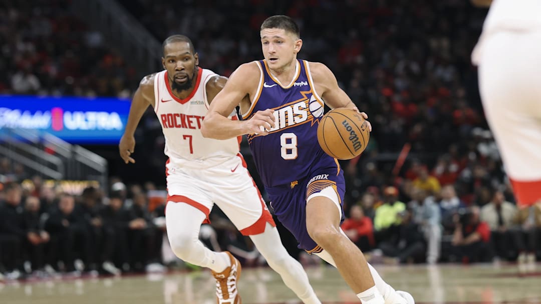 Dec 5, 2025; Houston, Texas, USA; Phoenix Suns guard Grayson Allen (8) dribbles the ball as Houston Rockets forward Kevin Durant (7) defends during the third quarter at Toyota Center. Mandatory Credit: Troy Taormina-Imagn Images