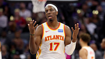 Onyeka Okongwu throws his hands up against the Sacremento Kings.