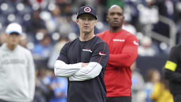 Houston Texans offensive coordinator Bobby Slowik and head coach DeMeco Ryans look on before the game against the Los Angeles Chargers in an AFC wild card game at NRG Stadium.