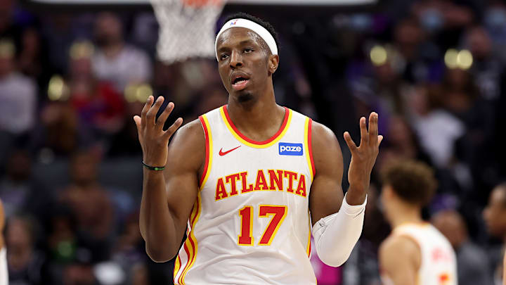 Onyeka Okongwu throws his hands up against the Sacremento Kings.