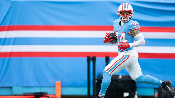 Tennessee Titans cornerback Elijah Molden (24) runs back an interception for a touchdown against the Houston Texans during their game at Nissan Stadium in Nashville, Tenn., Sunday, Dec. 17, 2023.