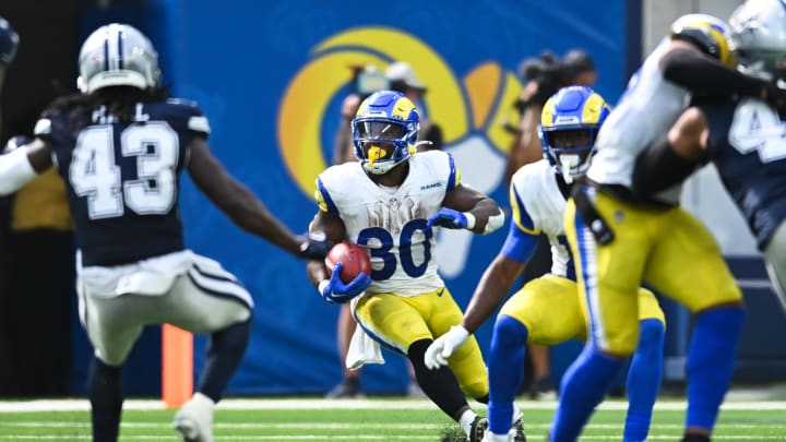 Aug 11, 2024; Inglewood, California, USA; Los Angeles Rams running back Boston Scott (30) runs the ball against the Dallas Cowboys during the fourth quarter at SoFi Stadium. Mandatory Credit: Jonathan Hui-USA TODAY Sports