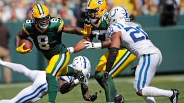 Green Bay Packers running back Josh Jacobs (8) runs for a first down against Indianapolis Colts safety Nick Cross (20) during their football game Sunday, September 15, 2024, at Lambeau Field in Green Bay, Wisconsin.