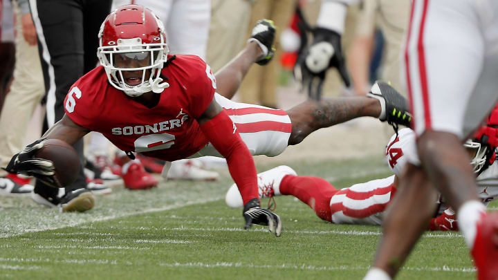 Oklahoma's Deion Burks dives for more yards during a University of Oklahoma (OU) Sooners spring football game at Gaylord Family-Oklahoma Memorial Stadium in Norman, Okla., Saturday, April 20, 2024.