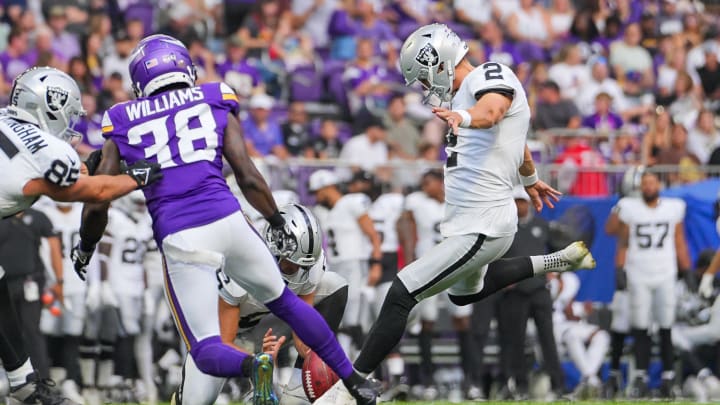 Aug 10, 2024; Minneapolis, Minnesota, USA; Las Vegas Raiders kicker Daniel Carlson kicks an extra point against the Minnesota Vikings in the second quarter at U.S. Bank Stadium. Mandatory Credit: Brad Rempel-USA TODAY Sports