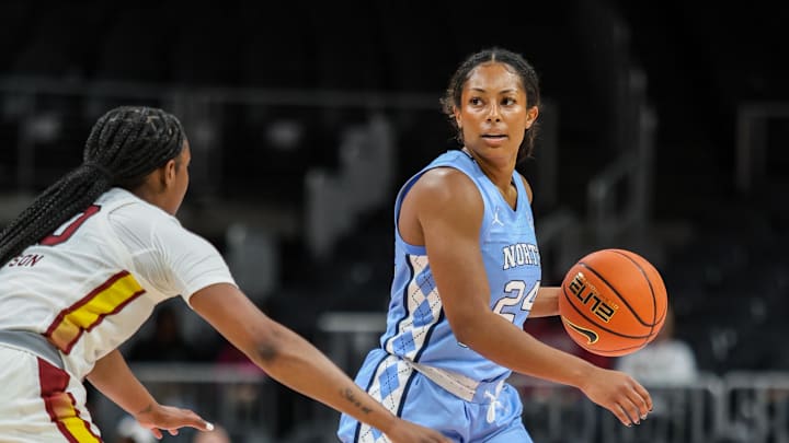 Oct 30, 2025; Atlanta, GA, USA; North Carolina Tar Heels guard Indya Nivar (24) looks for the play against South Carolina Gamecocks guard Ta'Niya Latson (00) during the first quarter at State Farm Arena. Mandatory Credit: Jordan Godfree-Imagn Images
