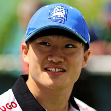 May 5, 2024; Miami Gardens, Florida, USA; RB racing driver Yuki Tsunoda (22) walks into the F1 Village before the F1 Miami Grand Prix at Miami International Autodrome. Mandatory Credit: Peter Casey-Imagn Images