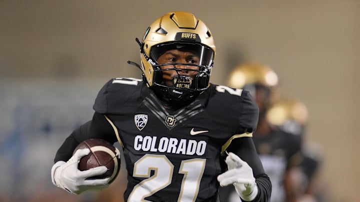 Colorado Buffaloes safety Shilo Sanders runs for a touchdown after making an interception against the Colorado State Rams. Colorado Buffaloes safety Shilo Sanders runs for a touchdown after making an interception against the Colorado State Rams.