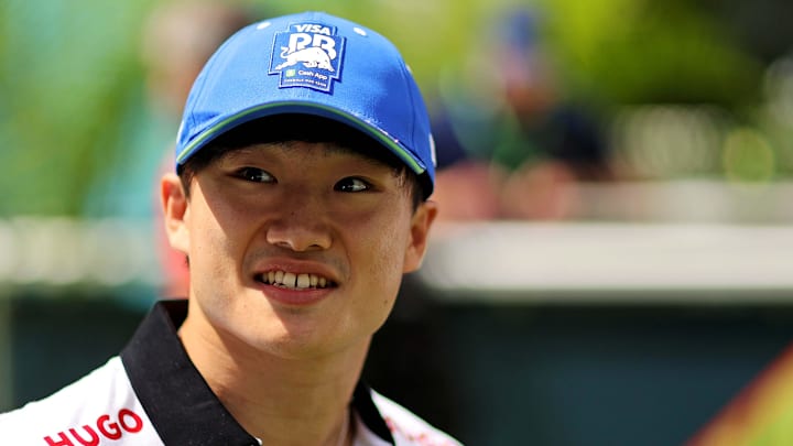 May 5, 2024; Miami Gardens, Florida, USA; RB racing driver Yuki Tsunoda (22) walks into the F1 Village before the F1 Miami Grand Prix at Miami International Autodrome. Mandatory Credit: Peter Casey-Imagn Images