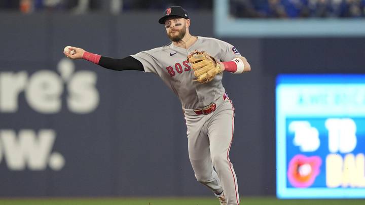 Sep 25, 2025; Toronto, Ontario, CAN; Boston Red Sox shortstop Trevor Story (10) makes a throwing error to first base on a ball hit by Toronto Blue Jays first baseman Vladimir Guerrero Jr. (not pictured) during the sixth inning at Rogers Centre. Mandatory Credit: John E. Sokolowski-Imagn Images