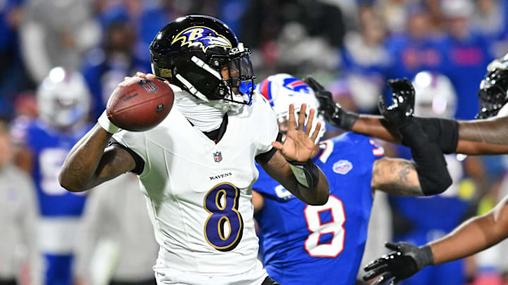Sep 7, 2025; Orchard Park, New York, USA; Baltimore Ravens quarterback Lamar Jackson (8) passes the ball against the Buffalo Bills during the first half at Highmark Stadium. Mandatory Credit: Mark Konezny-Imagn Images