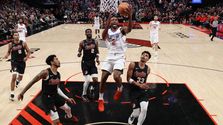 Mar 20, 2024; Portland, Oregon, USA; LA Clippers forward Kawhi Leonard (2) shoots the ball over Portland Trail Blazers forward Kris Murray (8), Trail Blazers’ guard Anfernee Simons (1), Trail Blazers’ center Deandre Ayton (2) and Trail Blazers’ forward Toumani Camara (33) in the second half at Moda Center. Mandatory Credit: Jaime Valdez-USA TODAY Sports