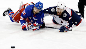 Vincent Trocheck battles Sean Kuraly at the face-off dot
