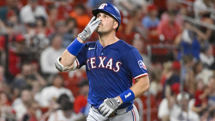 Jul 29, 2024; St. Louis, Missouri, USA;  Texas Rangers first baseman Nathaniel Lowe (30) reacts after hitting a two run home run against the St. Louis Cardinals during the seventh inning at Busch Stadium. Mandatory Credit: Jeff Curry-USA TODAY Sports