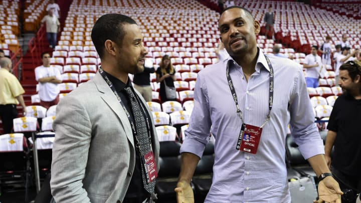Jun 12, 2014; Miami, FL, USA; Former players Trajan Langdon (left) and Grant Hill (right) talk prior to game four of the 2014 NBA Finals between the Miami Heat and the San Antonio Spurs at American Airlines Arena. Mandatory Credit: Bob Donnan-USA TODAY Sports