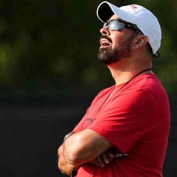 Aug 1, 2024; Columbus, OH, USA; Ohio State Buckeyes head coach Ryan Day watches a punt during football camp at the Woody Hayes Athletic Complex.