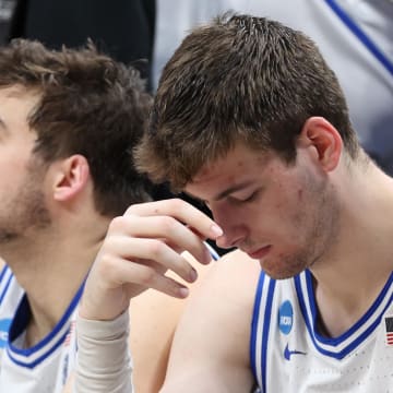 Mar 31, 2024; Dallas, TX, USA; Duke Blue Devils center Ryan Young (15) and center Kyle Filipowski (30) react from the bench in the second half against the North Carolina State Wolfpack in the finals of the South Regional of the 2024 NCAA Tournament at American Airline Center. Mandatory Credit: Tim Heitman-USA TODAY Sports