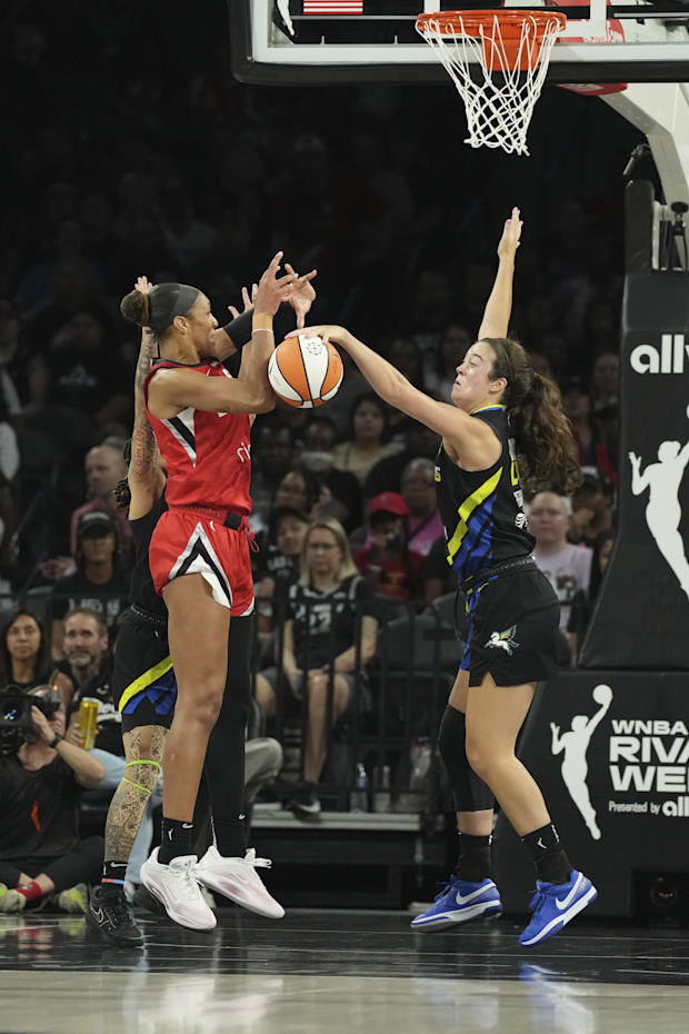 Dallas Wings forward Maddy Siegrist blocks a shot by Las Vegas Aces center A'ja Wilson