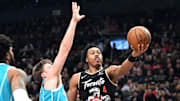 Raptors forward Scottie Barnes shoots the ball against Hornets forward Kon Kneuppel.