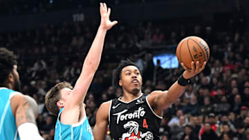 Raptors forward Scottie Barnes shoots the ball against Hornets forward Kon Kneuppel.